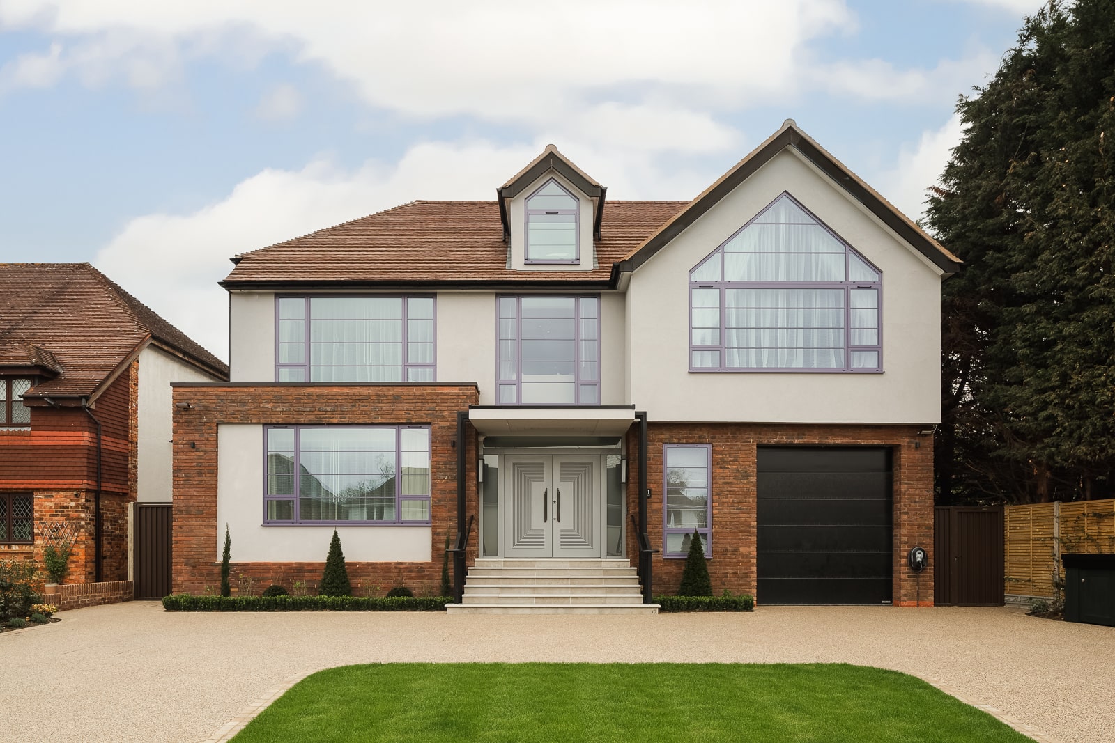 The front of newly built house with energy efficient additions to the property which have lowered the energy bills for the owners remarkably